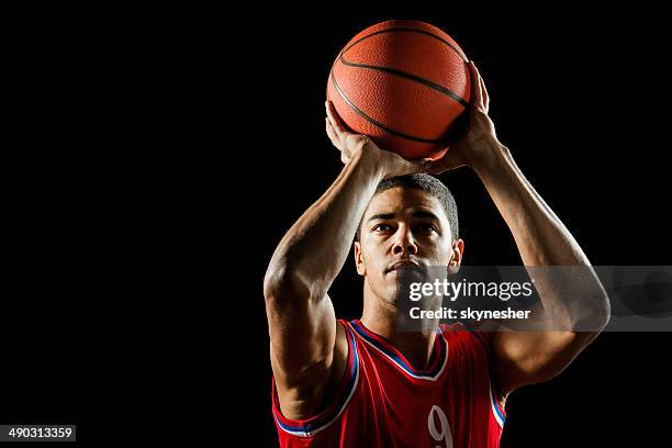 man shooting at the hoop. - basket ball player stock pictures, royalty-free photos & images