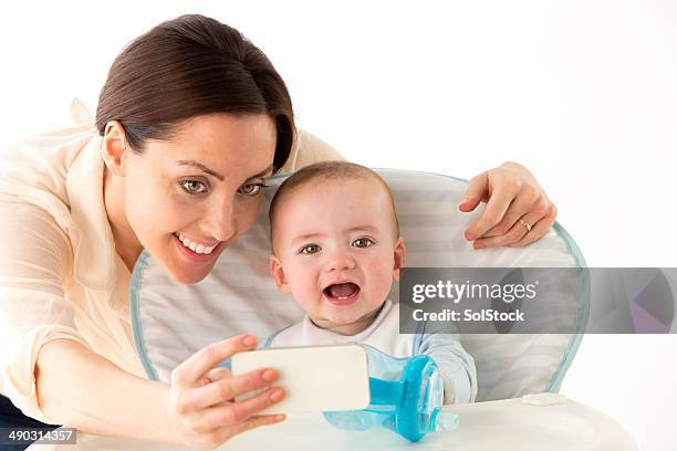 mother and baby taking a selfie - moving up to seated position stock pictures, royalty-free photos & images