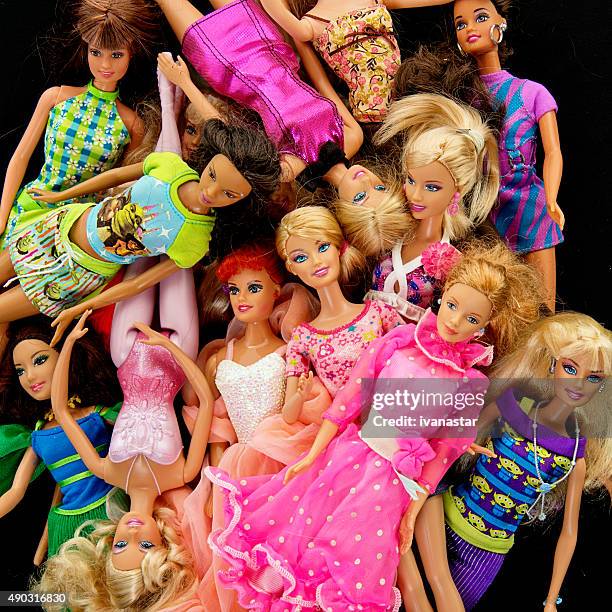 bunch of barbie fashon dolls - barbie princess stock pictures, royalty-free photos & images