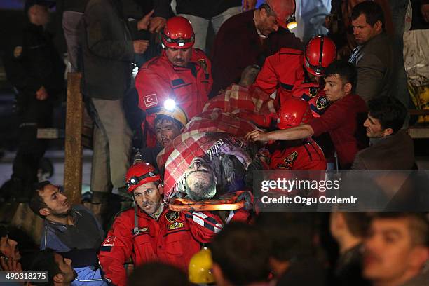 Miner is carried to an ambulance by rescue workers from the coal mine on May 14, 2014 in Soma, Manisa, Turkey. An explosion and fire in the coal mine...