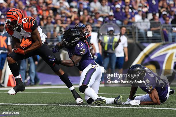 Wide receiver Marvin Jones of the Cincinnati Bengals scores a second quarter touchdown past cornerback Rashaan Melvin of the Baltimore Ravens and...