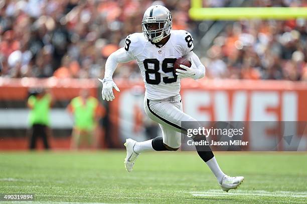 Amari Cooper of the Oakland Raiders carries the ball during the second quarter against the Cleveland Browns at FirstEnergy Stadium on September 27,...