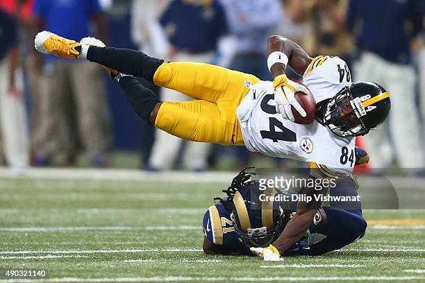 Antonio Brown of the Pittsburgh Steelers is tackled by Janoris Jenkins of the St. Louis Rams after making a catch in the first quarter at the Edward...