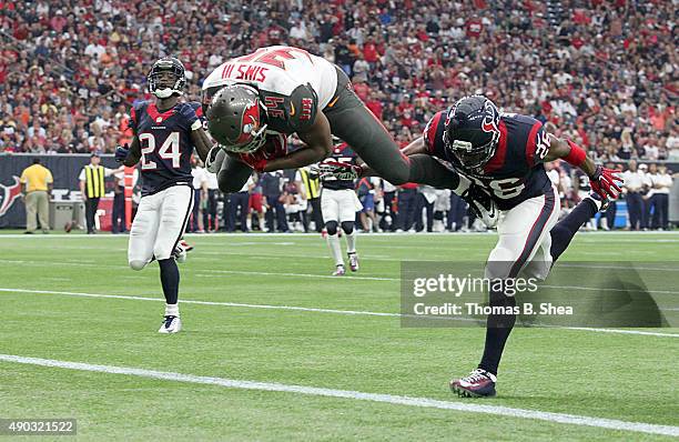 Charles Sims of the Tampa Bay Buccaneers catches a ball then run and flips into the end zone for a touchdown agains the Houston Texans in the second...