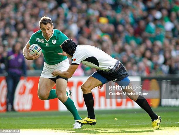 Tommy Bowe of Ireland runs with the ball during the 2015 Rugby World Cup Pool D match between Ireland and Romania at Wembley Stadium, on September...