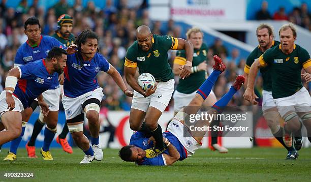 Pietersen of South Africa breaks past Mike Stanley of Samoa during the 2015 Rugby World Cup Pool B match between South Africa and Samoa at Villa Park...