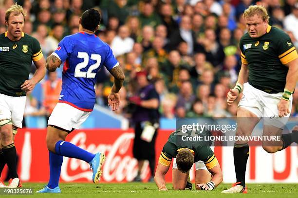 South Africa's captain and centre Jean de Villiers is seen after beiing injured during the Pool B match of the 2015 Rugby World Cup between South...