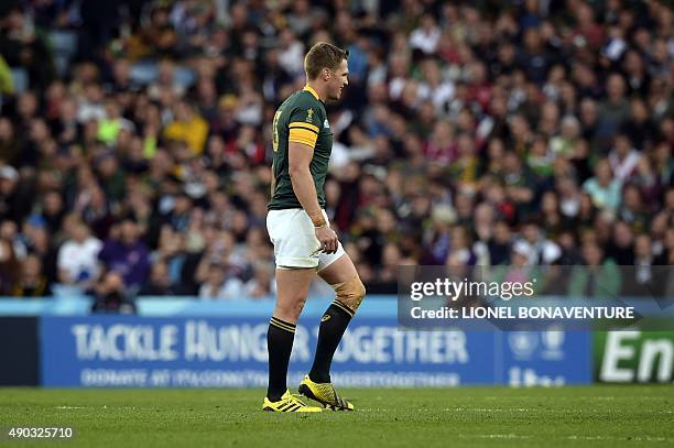 South Africa's captain and centre Jean de Villiers leaves the pitch after being injured during the Pool B match of the 2015 Rugby World Cup between...