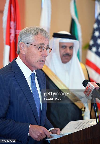 Defense Secretary Chuck Hagel speaks to the press as Gulf Cooperation Council Secretary General Abdullatif bin Rashid Al-Zayani watches at the GCC...