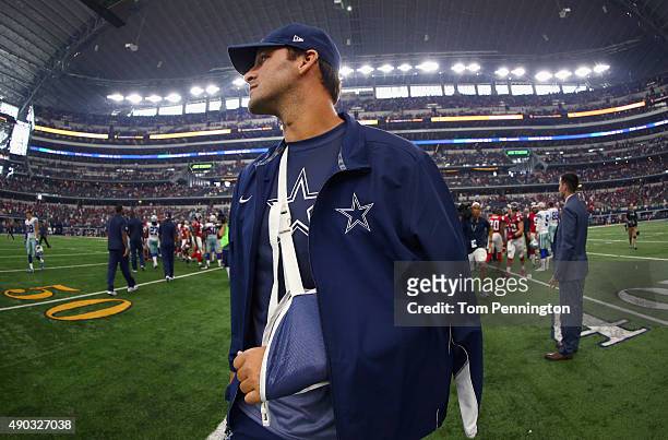 Tony Romo of the Dallas Cowboys walks off the field after the Atlanta Falcons beat the Cowboys 39-28 at AT&T Stadium on September 27, 2015 in...