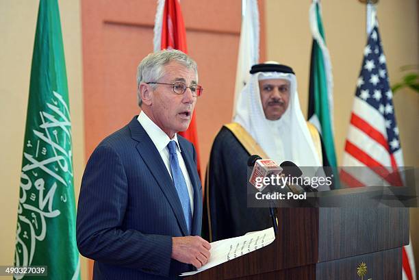 Defense Secretary Chuck Hagel speaks to the press as Gulf Cooperation Council Secretary General Abdullatif bin Rashid Al-Zayani watches at the GCC...