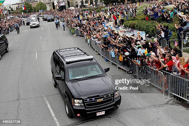 Pope Francis waves to the crowd from the Popemobile during a parade September 27, 2015 in Philadelphia, Pennsylvania. Pope Francis is in Philadelphia...