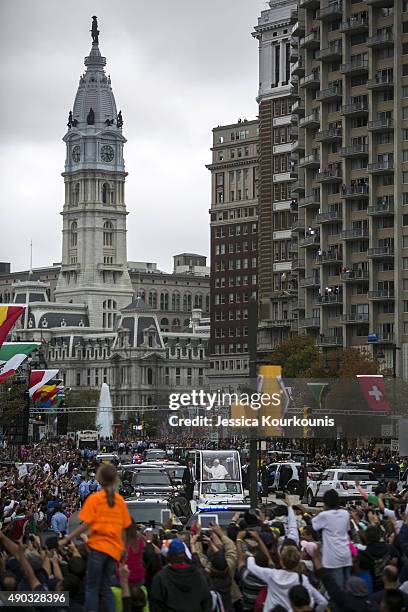 Pope Francis rides to mass in the Popemobile along Benjamin Franklin Parkway on September 27, 2015 in Philadelphia. This is the Pope's final day of a...