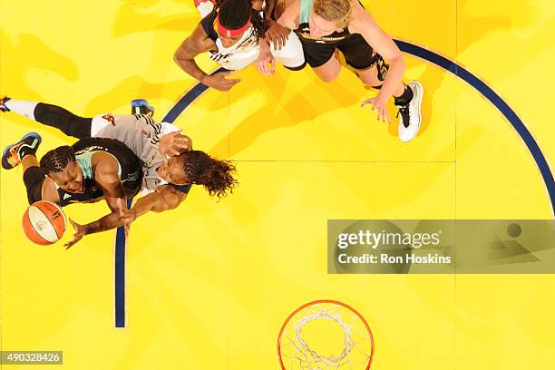 Epiphanny Prince of the New York Liberty drives to the basket against Tamika Catchings of the Indiana Fever in Game Two of the WNBA Eastern...