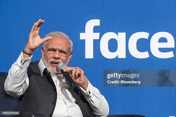 Narendra Modi, India's prime minister, left, speaks at Facebook Inc. Headquarters in Menlo Park, California, U.S., on Sunday, Sept. 27, 2015. Prime...