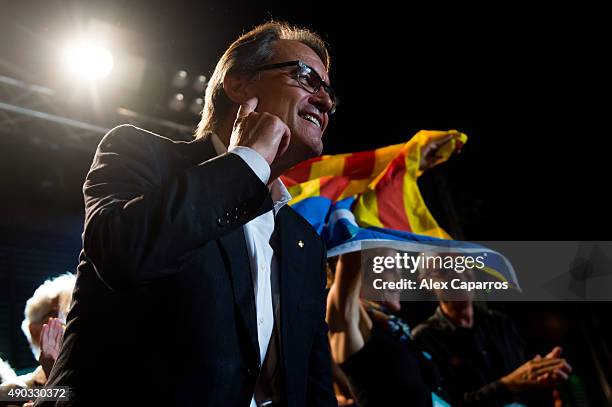 President of Catalonia Artur Mas gestures to wellwishers after the Catalanist coalition 'Junts pel Si' claimed victory in the regional elections held...