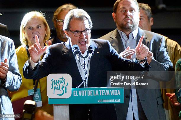 President of Catalonia Artur Mas celebrates as he speaks to wellwishers after the Catalanist coalition 'Junts pel Si' claimed victory in the regional...