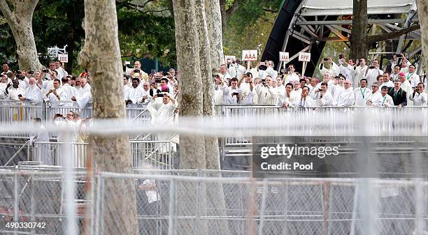 Clergy members gather to look at Pope Francis during a parade September 27, 2015 in Philadelphia, Pennsylvania. Pope Francis is in Philadelphia for...