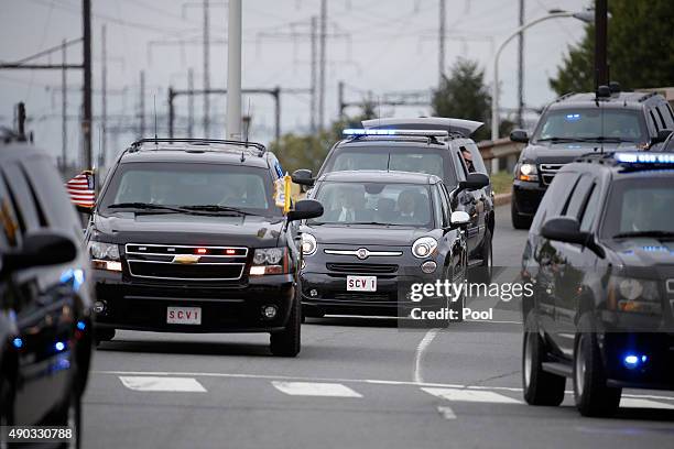 Pope Francis arrives in his Fiat 500, surrounded by a fleet of security vehicles September 27, 2015 in Philadelphia, Pennsylvania. Pope Francis is in...