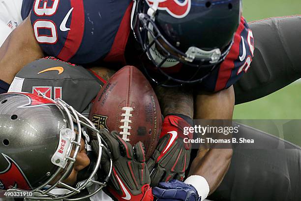 Louis Murphy of the Tampa Bay Buccaneers is tackled by Kevin Johnson of the Houston Texans in the fourth quarter on September 27, 2015 at NRG Stadium...