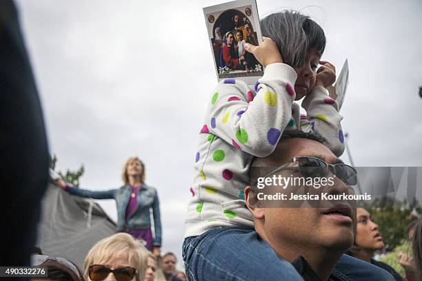 People watch as Pope Francis celebrates a public mass on Benjamin Franklin Parkway on September 27, 2015 in Philadelphia. Pope Francis wrapped up his...