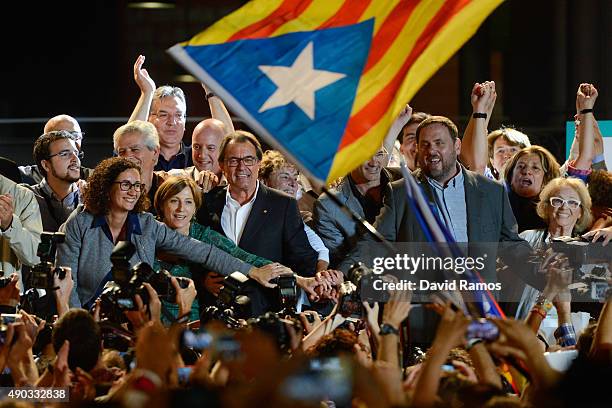 President of Catalonia Artur Mas and President of Catalonia 'Esquerra Republicana de Catalunya' party Oriol Junqueras celebrate after the Catalanist...
