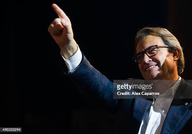 President of Catalonia Artur Mas waves to wellwishers after the Catalanist coalition 'Junts pel Si' won the regional elections held in Catalonia on...