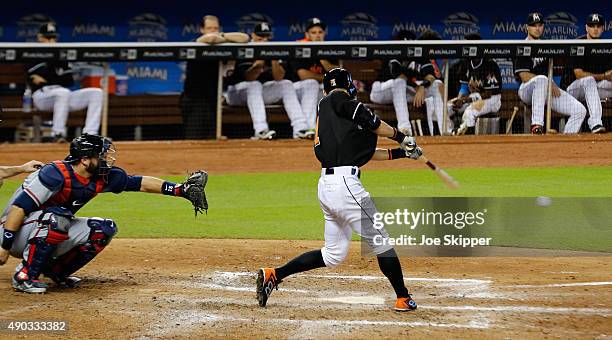 Ichiro Suzuki of the Miami Marlins grounds out in the seventh inning of play in front of A.J. Pierzynski of the Atlanta Braves at Marlins Park on...