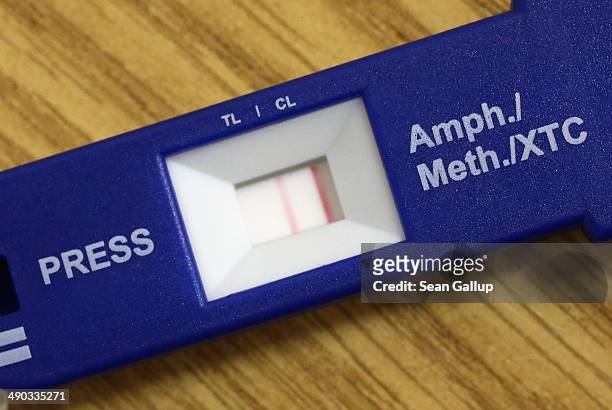 Double bar of a quick test kit shows a positive result for methamphetamine usage of a young man apprehended by German Customs on May 13, 2014 in...