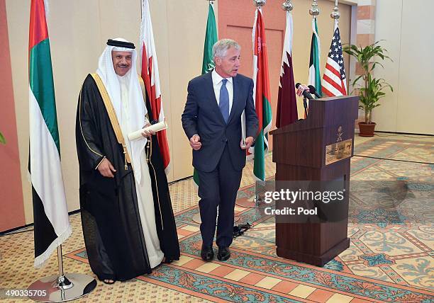 Gulf Cooperation Council Secretary General Abdullatif bin Rashid Al-Zayani and US Defense Secretary Chuck Hagel make their way from a lectern after...