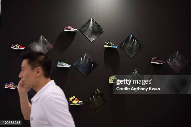 Visitor is seen in front of an art installation at Art Basel Exhibition on May 14, 2014 at the Hong Kong Convention and Exhibition Centre in Wan...