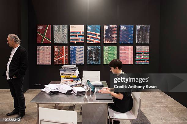 Visitor and an exhibitor are seen at the Art Basel Exhibition on May 14, 2014 at the Hong Kong Convention and Exhibition Centre in Wan Chai, Hong...