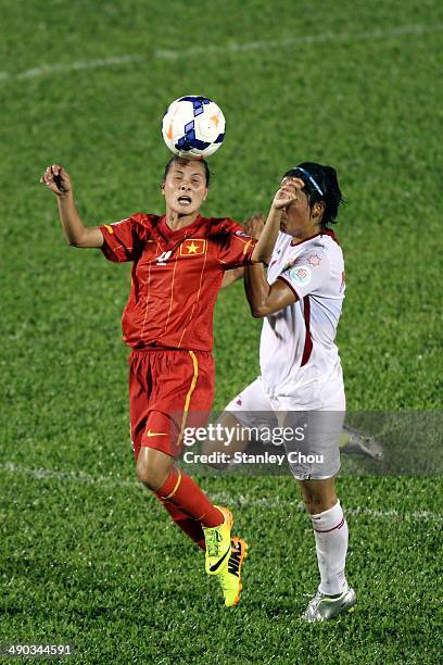 Nguyen Thi Nga of Vietnam clashes with Maysa Ziad of Jordan during the AFC Women's Asian Cup Group A match between Vietnam and Jordan at Thong Nhat...
