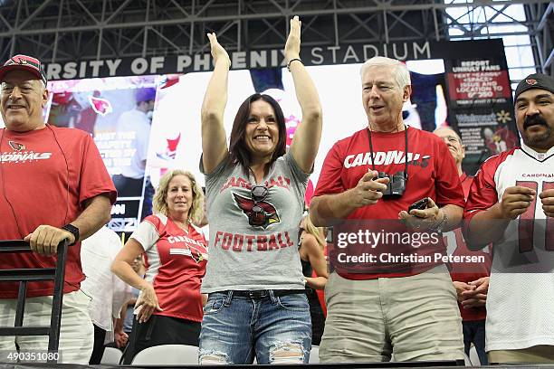 Intern Coach Jen Welter of the Arizona Cardinals cheers from the stands during the NFL game against the San Francisco 49ers at the University of...
