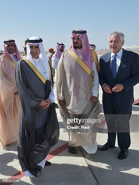 Defense Secretary Chuck Hagel chats with Saudi Deputy Defence Minister Salman bin Sultan before boarding his flight at King Abdulaziz International...