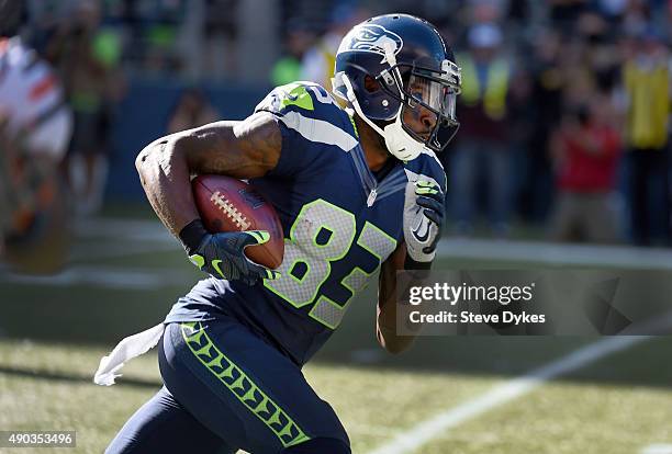 Wide receiver Ricardo Lockette of the Seattle Seahawks runs with a pass reception during the third quarter of the game against the Chicago Bears at...