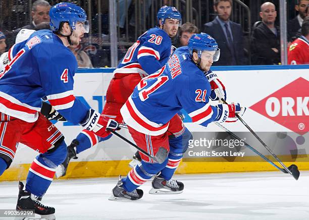 Derek Stepan, Chris Kreider and Raphael Diaz of the New York Rangers skate up the ice against the Pittsburgh Penguins in Game Four of the Second...