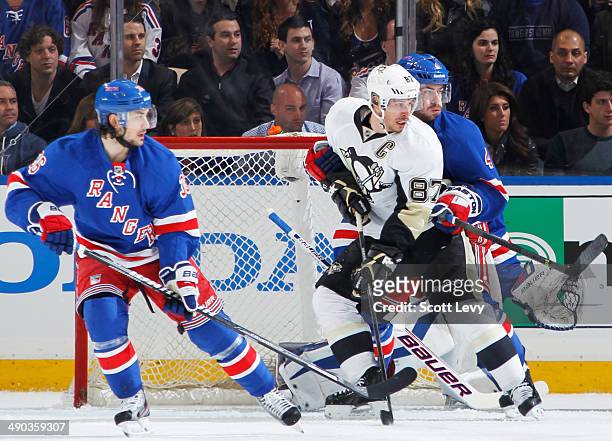 Mats Zuccarello and Raphael Diaz of the New York Rangers skate against Sidney Crosby of the Pittsburgh Penguins in Game Four of the Second Round of...