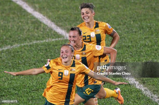 Caitlin Foord of Australia celebrates with her team-mates after scoring against Japan during the AFC Women's Asian Cup Group B match between...