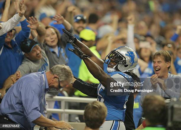 Joique Bell of the Detroit Lions celebrates a second-quarter touchdown against he Denver Broncos at Ford Field on September 27, 2014 in Detroit,...