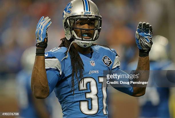 Rashean Mathis of the Detroit Lions encourages the crown to make noise while playing the Denver Broncos at Ford Field on September 27, 2014 in...