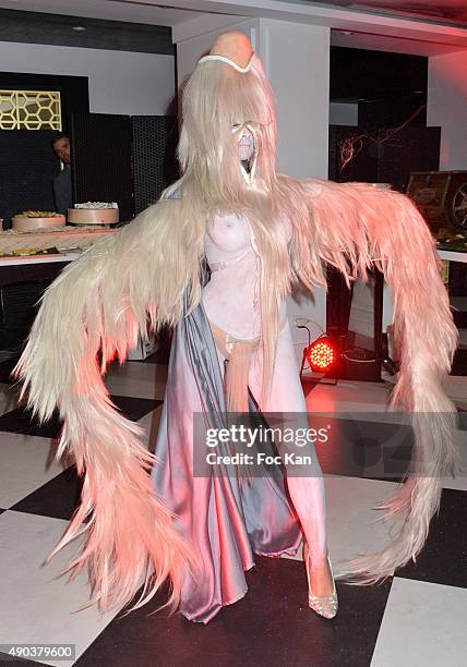 Dancer dressed by Charlie Le Mindu performs during the 'Fromage Fashion Week Menu Day' at Sofitel Stay Hotel on September 27, 2015 in Paris, France.