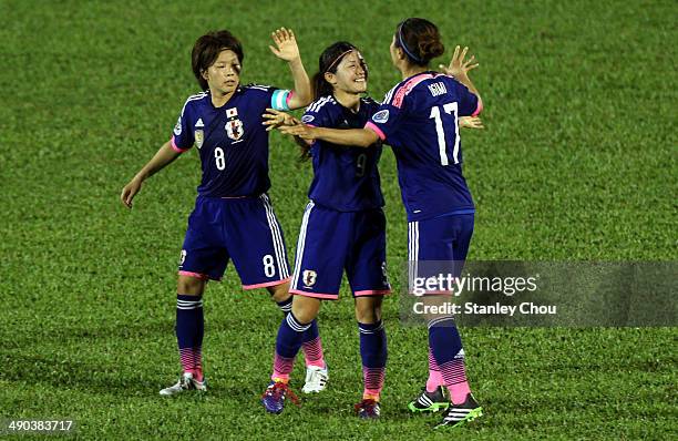 Yuki Ogimi of Japan celebrates with her team-mates after scoring against Australia during the AFC Women's Asian Cup Group A match between Australia...