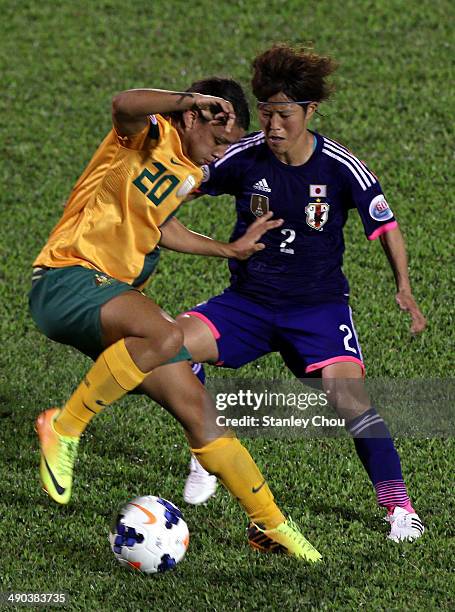 Samantha May Kerr of Australia battles with Saori Ariyoshi of Japan during the AFC Women's Asian Cup Group A match between Australia and Japan at...