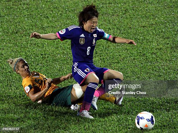 Aya Miyama of Japan clashes with Katrina Gorry of Australia during the AFC Women's Asian Cup Group A match between Australia and Japan at Thong Nhat...