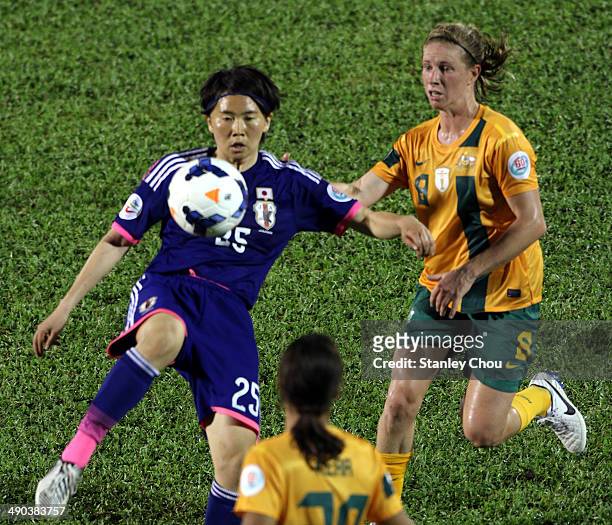 Michi Goto of Japan clashes with Elise Kellond-Knight of Australia during the AFC Women's Asian Cup Group A match between Australia and Japan at...