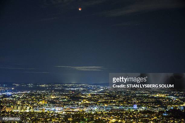 So-called "super moon" hangs in the sky over Oslo during a total lunar eclipse on September 28, 2015. Skygazers were treated to a rare astronomical...