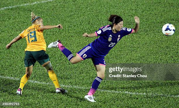 Michi Goto of Japan is checked by Katrina Gorry of Australia during the AFC Women's Asian Cup Group A match between Australia and Japan at Thong Nhat...