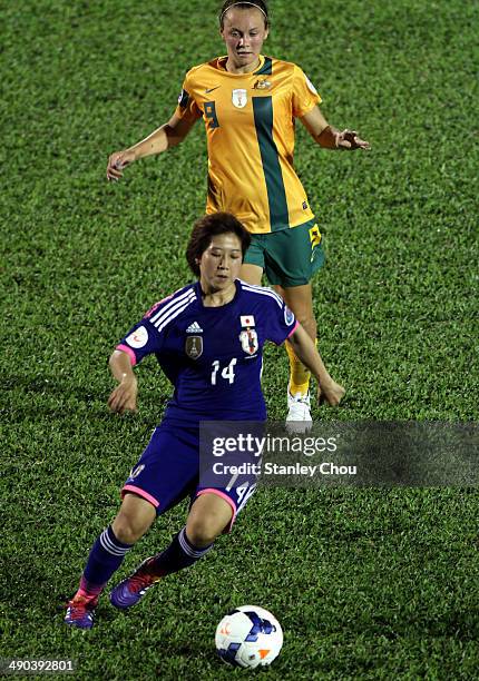 Nanase Kiryu of Japan is pursuit by Catley Foord of Australia during the AFC Women's Asian Cup Group A match between Australia and Japan at Thong...