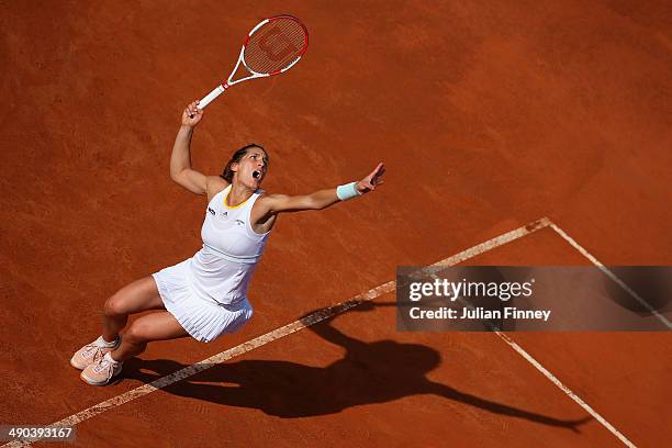 Andrea Petkovic of Germany serves in her match against Serena Williams of USA during day four of the Internazionali BNL d'Italia tennis 2014 on May...